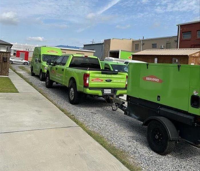 SERVPRO trucks lined up on large-loss job