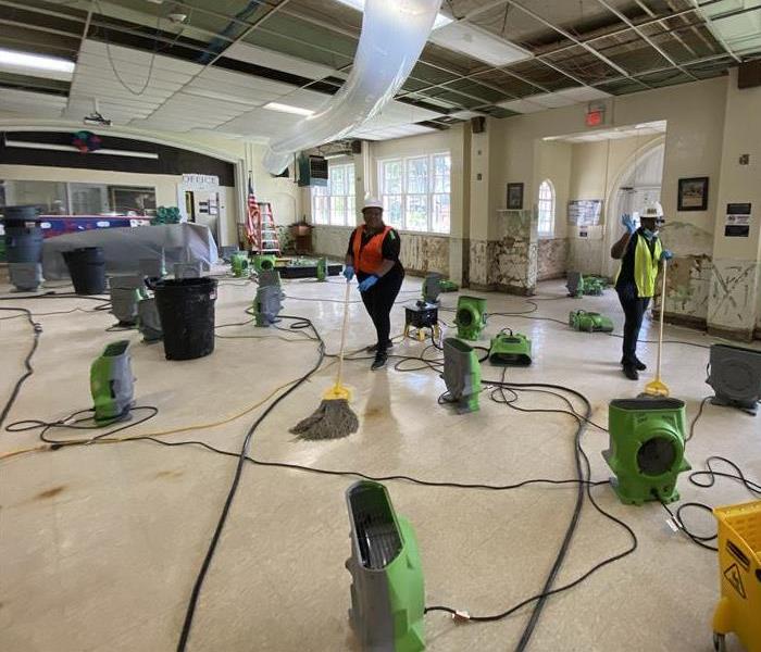 Large water loss in local school. SERVPRO Equipment and technicians on site cleaning up.